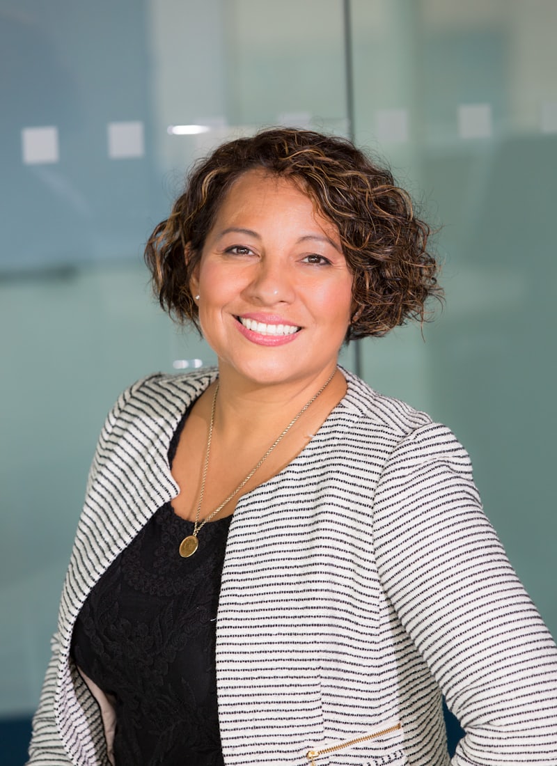 A candidate smiling in an office