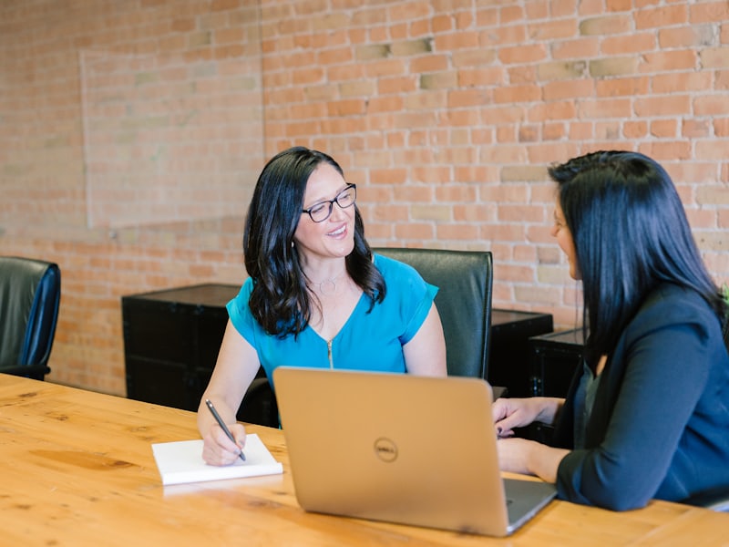 An interview in progress across an office table